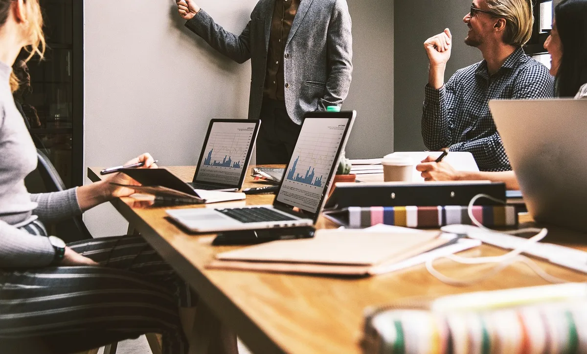A growing business team collaborating during a strategy meeting in a modern office